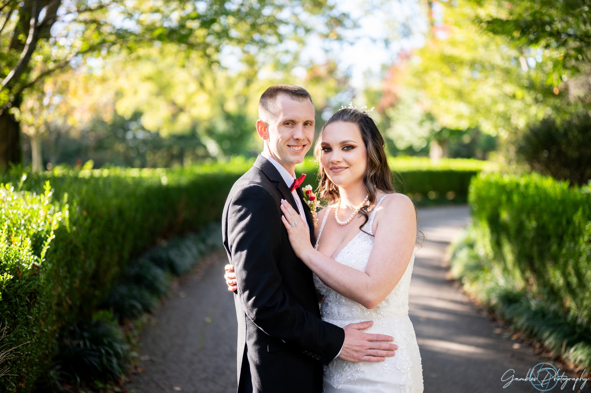 a couple poses during their wedding at Haseltine Estate. Photo by Gambles Photography